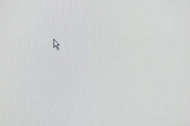 Photo of arrow computer mouse pointer on white lcd screen