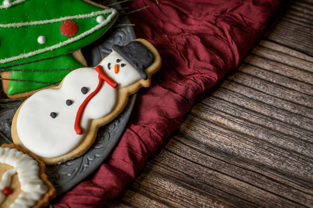 istock Christmas cookies on wooden table 852055240
