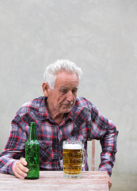 istock Senior man with beer bottle and mug 852058866
