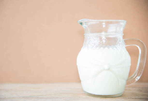 istock milk in glass on table healthy concept. 852059546