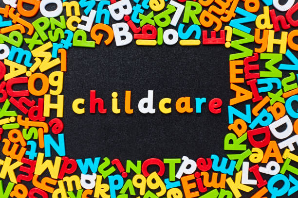 istock Overhead view of child care text amidst colorful alphabets 852060394