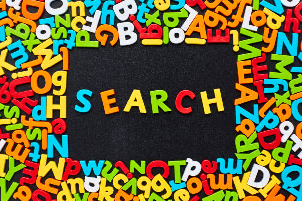 istock Overhead view of search text amidst colorful alphabets on blackboard 852062780