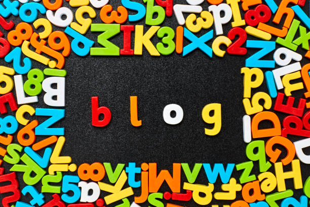 istock Overhead view of blog text amidst colorful alphabets and numbers 852063202