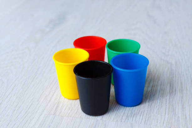 istock Colorful Plastic caps on wood white background 852063210