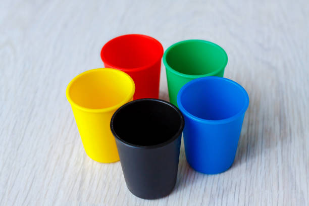 istock Colorful Plastic caps on wood white background 852063234