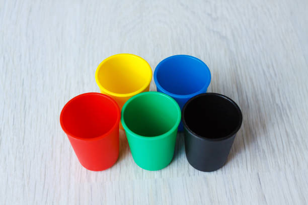 istock Colorful Plastic caps on wood white background 852063262