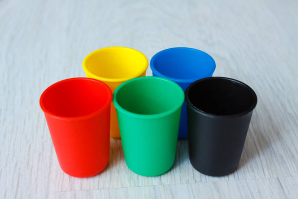 istock Colorful Plastic caps on wood white background 852063272