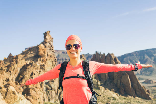 istock Climbing or hiking success with arms outstretched in mountains 852064342