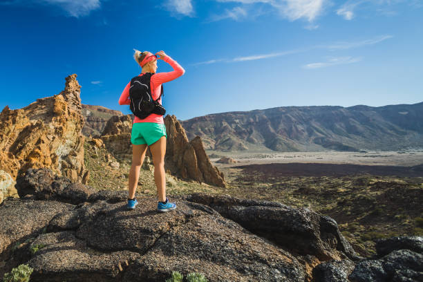 istock Woman hiker reached mountain top, backpacker adventure 852065524
