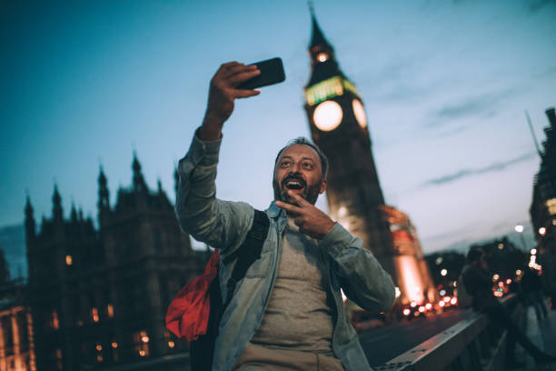 istock Tourist man in London making selfie 852069144