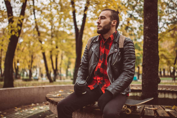istock Young skater man relaxing in park 852073752