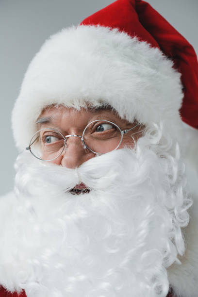istock cheerful santa in eyeglasses 852074138