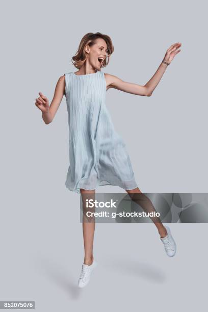 Beauty In Motion Stock Photo - Download Image Now - Women, Jumping, One Woman Only