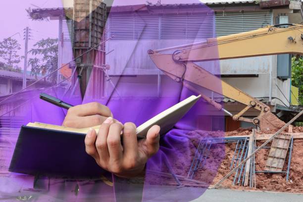 istock Double exposure of businessman  with notepad in hand signing documents in construction  site workplace concept. 852078576