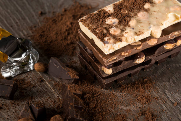 istock Milk and dark chocolate on a wooden table 852088730