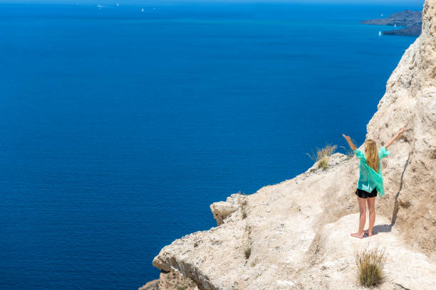 istock Joyful woman & seascape & volcano 852088992