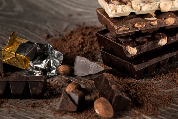 istock Milk and dark chocolate on a wooden table 852089208