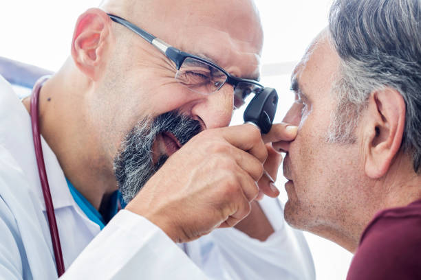 istock Elderly man examined by an ophthalmologist 852092492