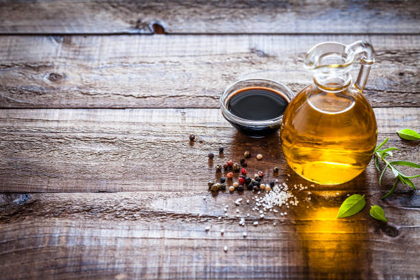 istock Oil and vinegar on rustic wooden table 852092600
