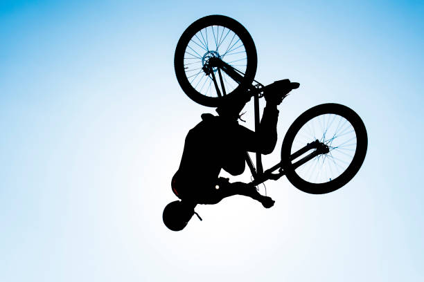 istock bmx rider performing stunt in the air 852098684