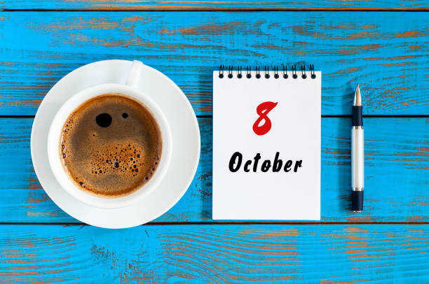 istock October 8th. Day 8 of october month, calendar on workbook with coffee cup at student workplace background. Autumn time 852099922