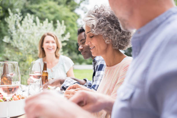istock Focus on mature woman with grey curly hair having dinner 852102518