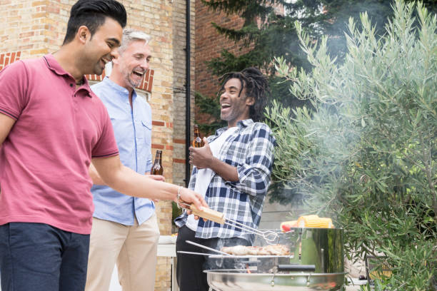 istock Three men having bbq in garden with beer 852102628