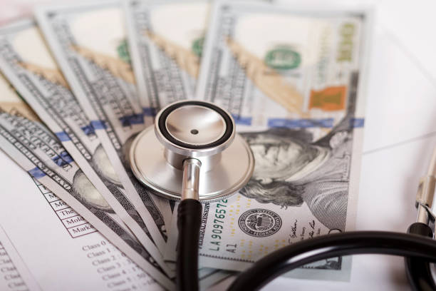 istock Assay form, dollars and phonendoscope close-up 852103130