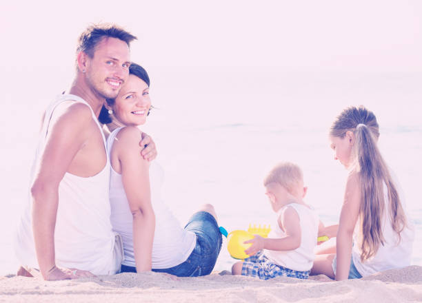 istock Happy family and kids sitting with back forward 852103314