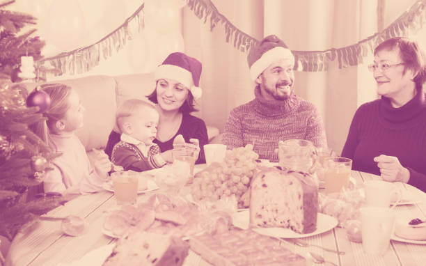 istock family talking animatedly during Christmas dinner 852103466
