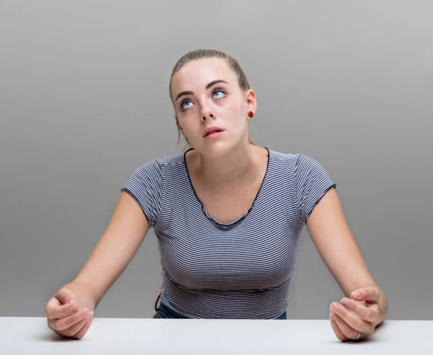 istock stressed woman portrait on gray 852106058