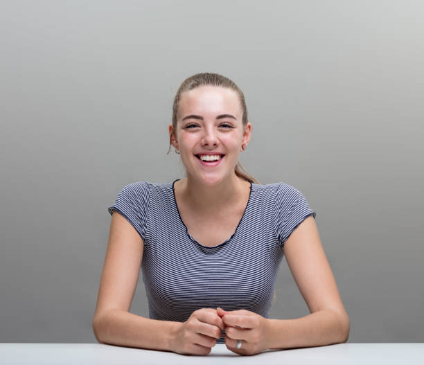istock smiling woman portrait on gray 852106158