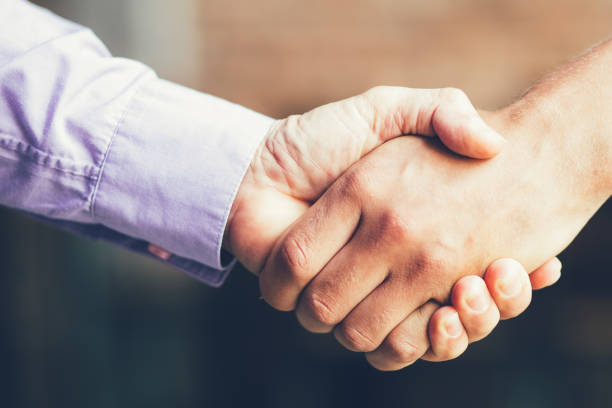 istock Closeup of Two Business Men Shaking Hands 852107302