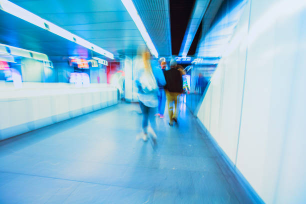 istock subway train passing through station, passengers waiting on the platform 852110454