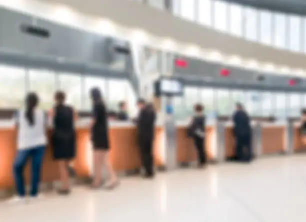 Photo of Blurred customer transaction in bank counter