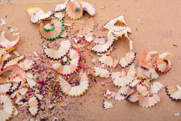 istock Colorful pencil shavings on brown background 852119420
