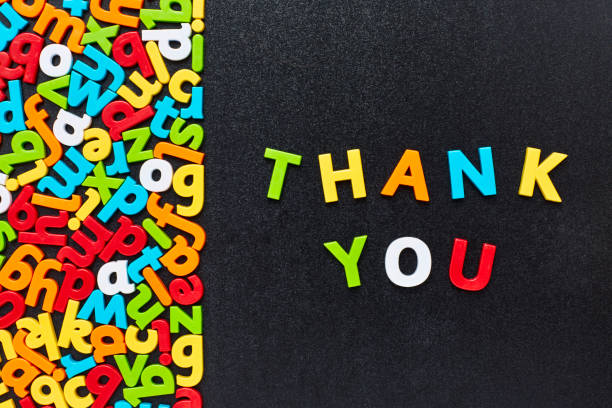 istock Overhead view of thank you text by colorful alphabets 852119762