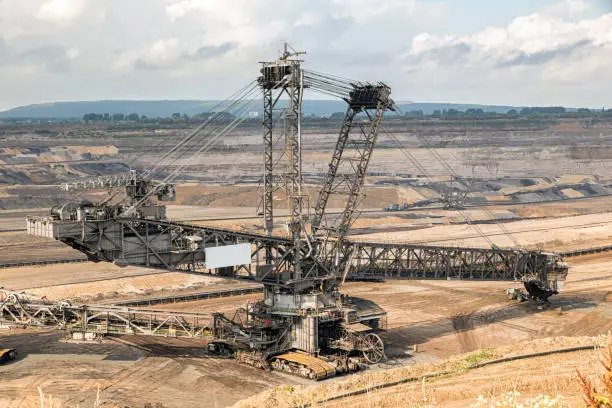 Huge bucket-wheel excavator mining lignite (brown-coal) in an open pit mine.