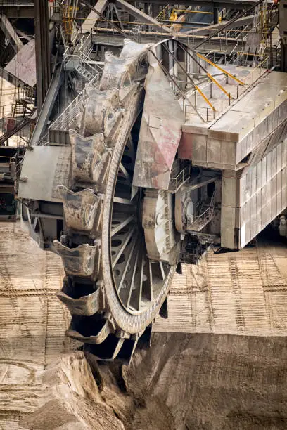 Huge bucket-wheel excavator mining lignite (brown-coal) in an open pit mine.