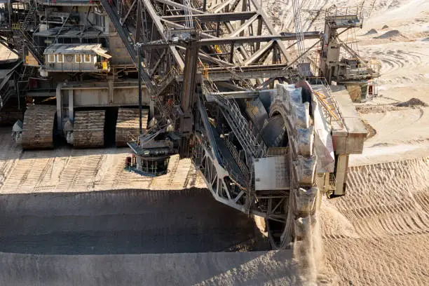 Huge bucket-wheel excavator mining lignite (brown-coal) in an open pit mine.