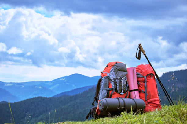 istock Backpacks in the mountains overlooking the mountains on the green grass. 852126108