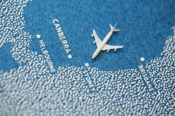 istock airplane fly on the blue painted map on the australia 852145608