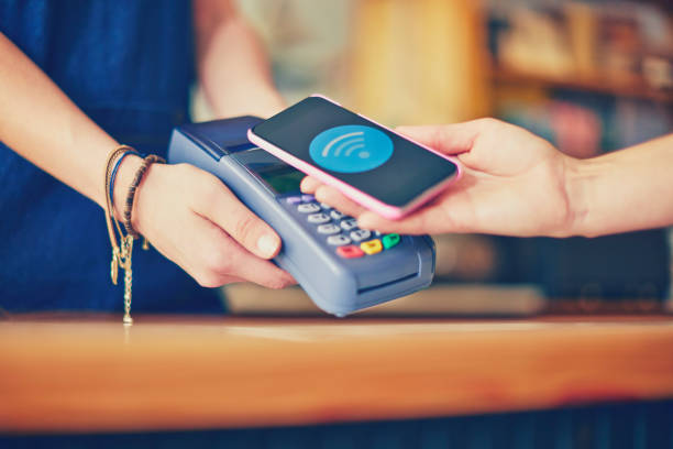 istock Customer making contactless payment with smart phone at store 852152364