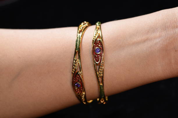 istock Fancy gold looking imitation bangles / bracelets on the woman's wrist 852152592