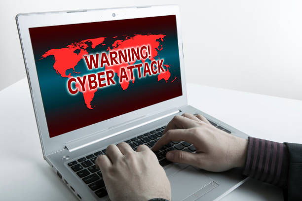istock human fingers on the Tablet PC with inscription warning cyber attack 852178238