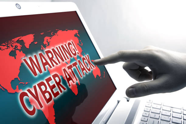 istock human finger on the Tablet PC with inscription warning cyber attack 852178292