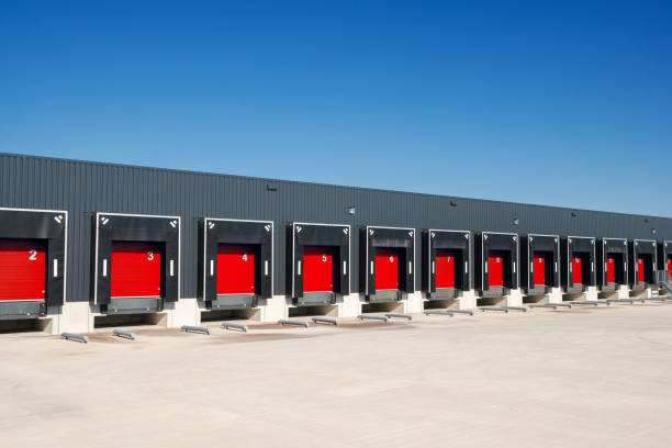 Loading docks Row of loading docks with shutter doors at a warehouse loading bay stock pictures, royalty-free photos & images