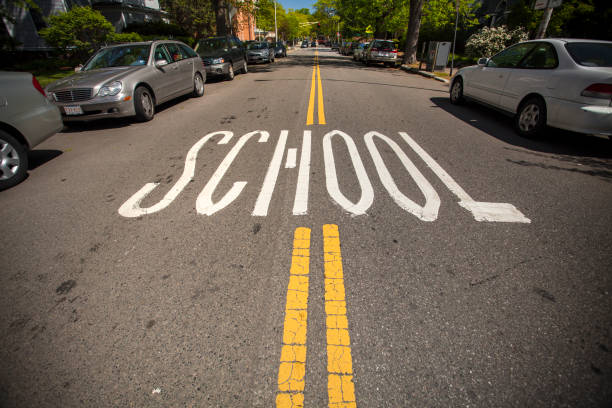 Boston: Cross walk in a school area.  A school zone refers to an area on a street near a school or near a crosswalk leading to a school that has a likely presence of younger pedestrians. School zones generally have a reduced speed limit during certain hours.