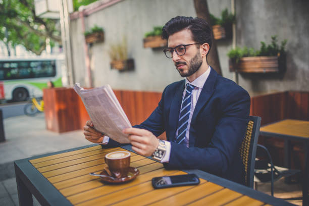 istock Gentleman sitting in cafe 852181640