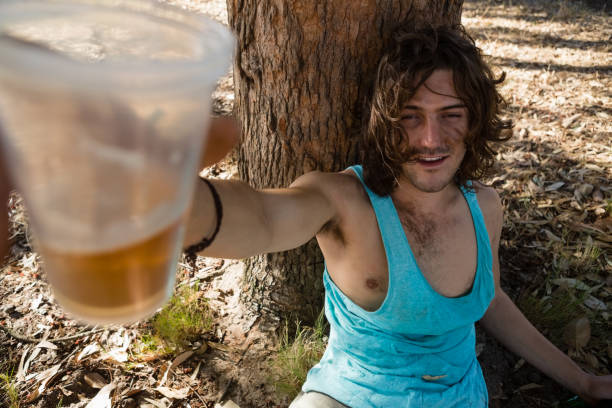istock Unconscious man having beer in the park 852185226
